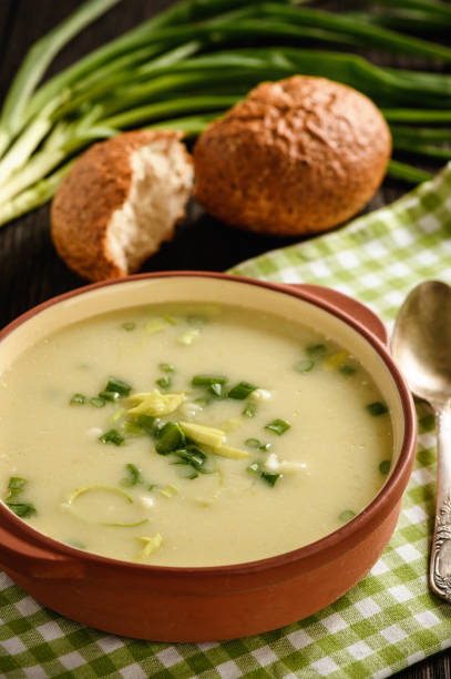 istock Leek cream soup on black background. 865667404