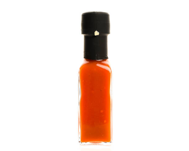 istock Hot Chili Sauce glass bottle on white background. 865669024
