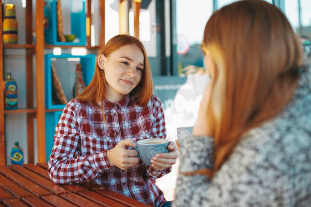 istock Smiling young women drinking coffee 865671104