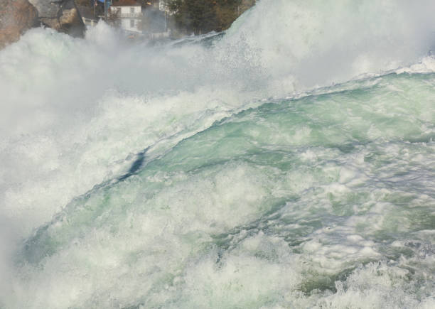 Partial view of the Rhine Falls waterfall in Switzerland seen from the Laufen castle. The Rhine Falls is the largest waterfall in Europe, located on the border between the Swiss cantons of Zurich and Schaffhausen.