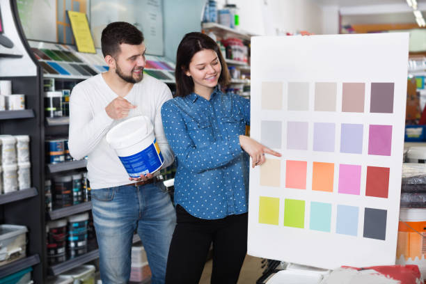 istock Couple deciding on best color scheme 865680240