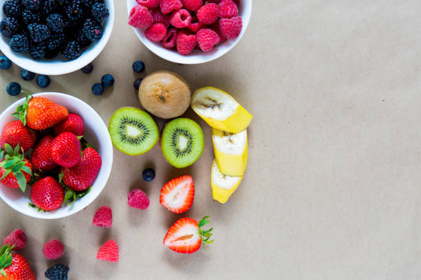istock Small white bowls filled with ripe berries. 865681008