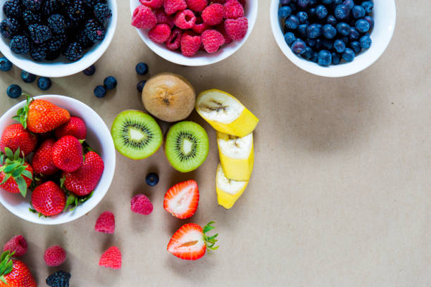 istock Small white bowls filled with ripe berries. 865683648