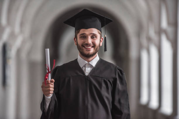 Handsome young alumnus stock photo