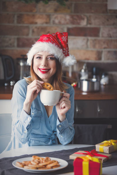 istock woman sitting at kitchen with present gifts 865684356
