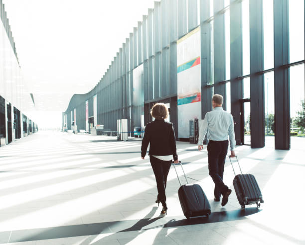 istock Business people walking in airport 865684684