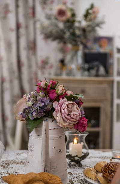 istock Beautiful bouquet in a white kettle 865685538