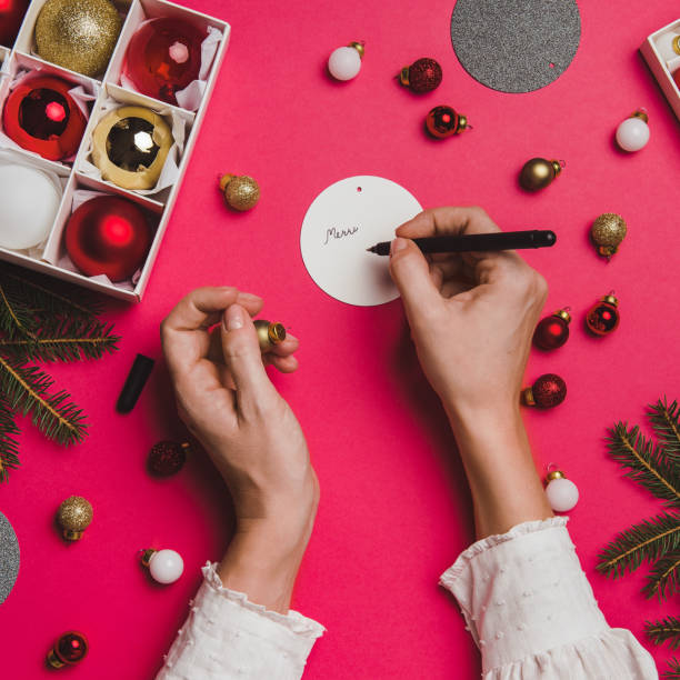 istock Christmas decoration from above overhead with woman hands 865689204