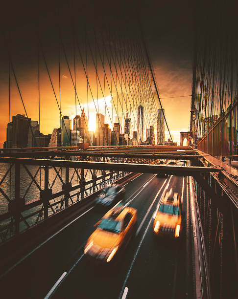 istock taxi running on brooklyn bridge 865691906