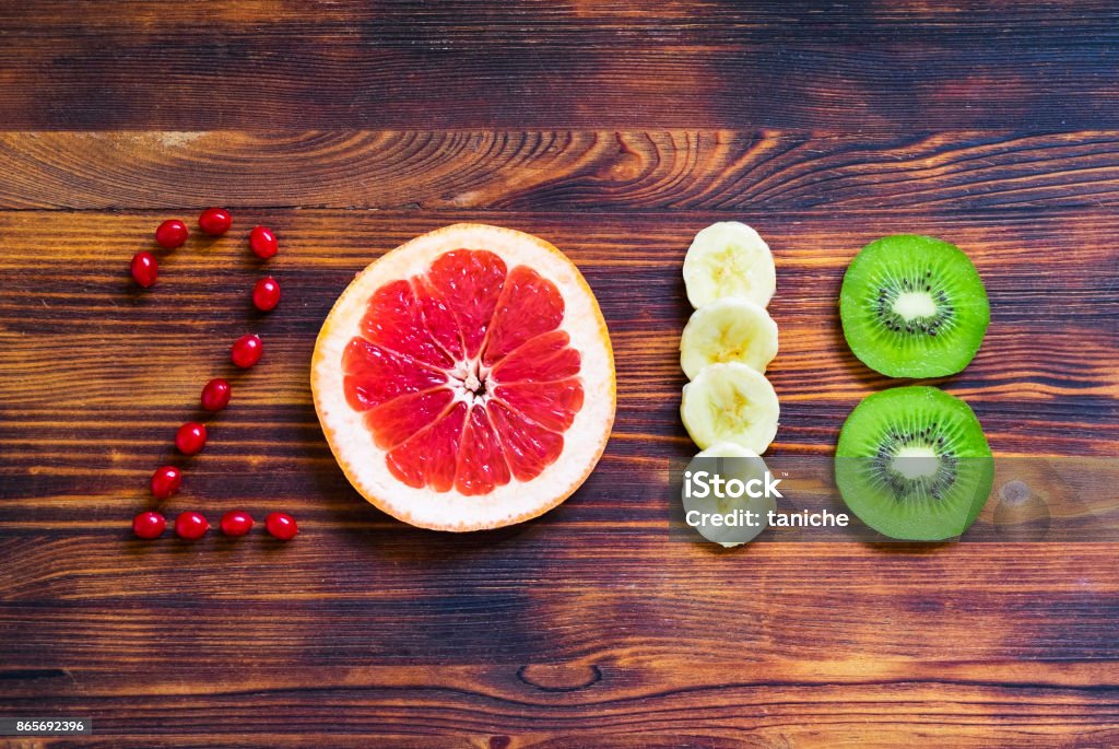 happy new year 2018 of fruit and berries on wooden background. happy new year 2018 of fruit and berries on wooden background 2018 Stock Photo