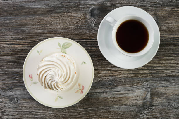 istock Sweet white meringue and cup of hot tea 865696036