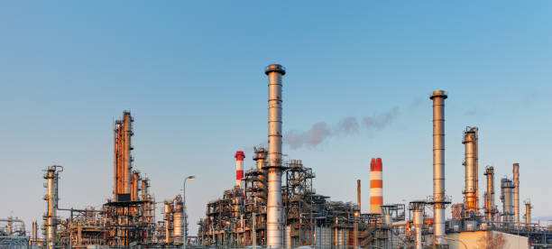 istock Factory with air pollution, Oil industry 865696966