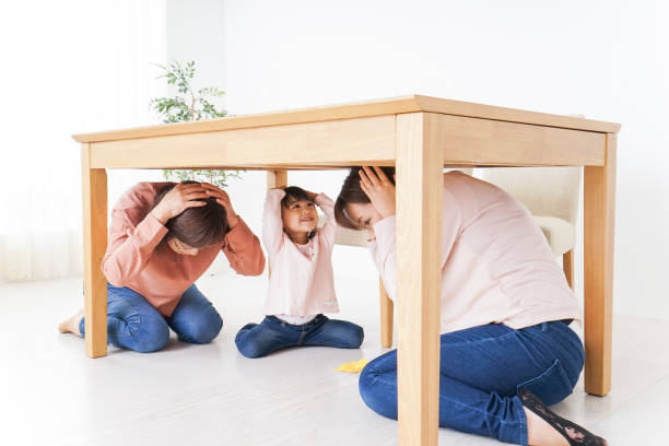 istock Family taking shelter under the desk 865700502