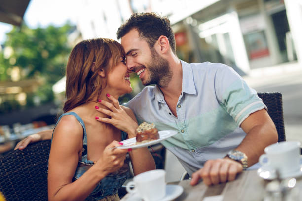 istock Young affectionate couple having a date in a cafe. 865700506