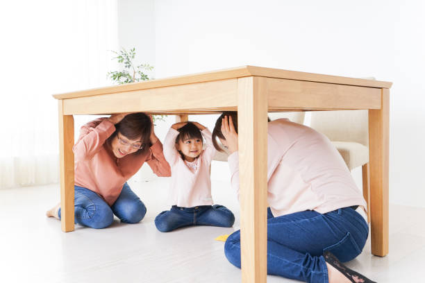 istock Family taking shelter under the desk 865700508