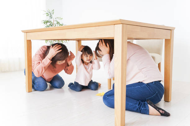 istock Family taking shelter under the desk 865700510