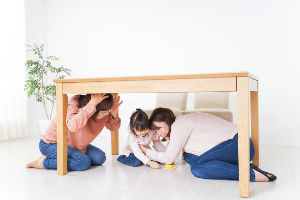 istock Family taking shelter under the desk 865700522