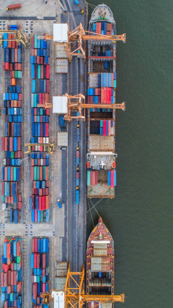 istock container,container ship in import export and business logistic,By crane,Trade Port , Shipping,cargo to harbor.Aerial view,Water transport,International,Shell Marine,transportation,logistic,trade,port 865701380