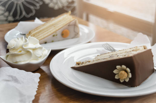 istock High-calorie breakfast: slices of cake and whipped cream 865701954