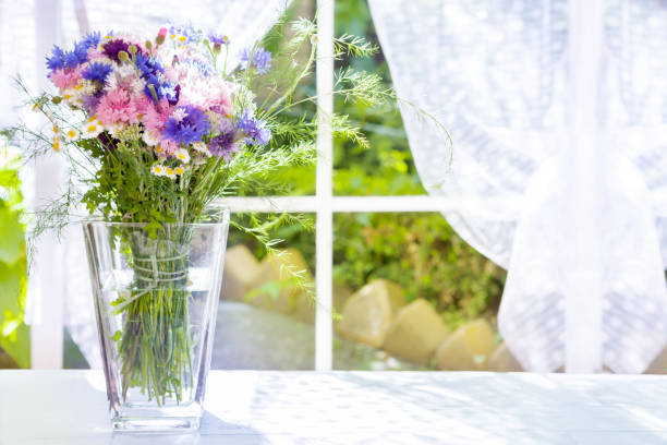 istock Fresh bouquet in glass vase 865705236