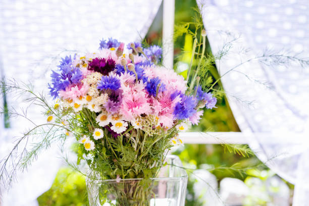istock Fresh flowers in glass vase 865705604