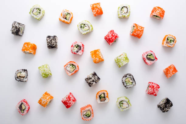 Top view on japanese sushi rolls, maki pattern on white background
