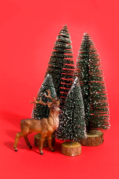 istock forest firs and reindeer red 865709804