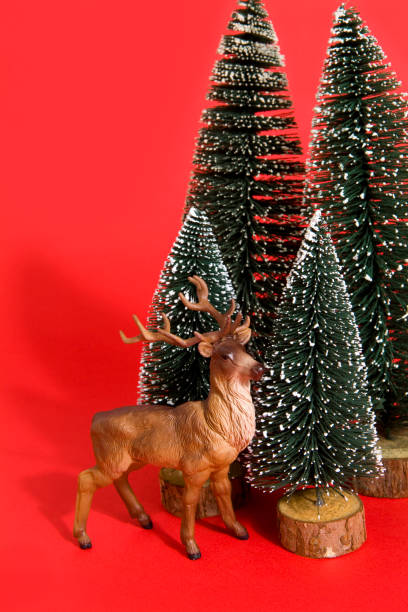 istock forest firs and reindeer red 865709808