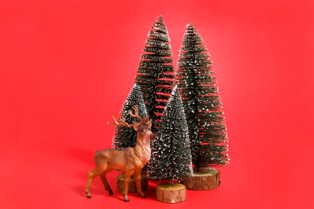 istock forest firs and reindeer red 865709828