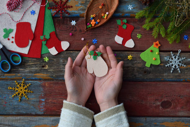 istock Making of handmade christmas toys from felt with your own hands. Children's DIY concept. Making xmas tree decoration or greeting card. Step 4. The finished toy 865712708