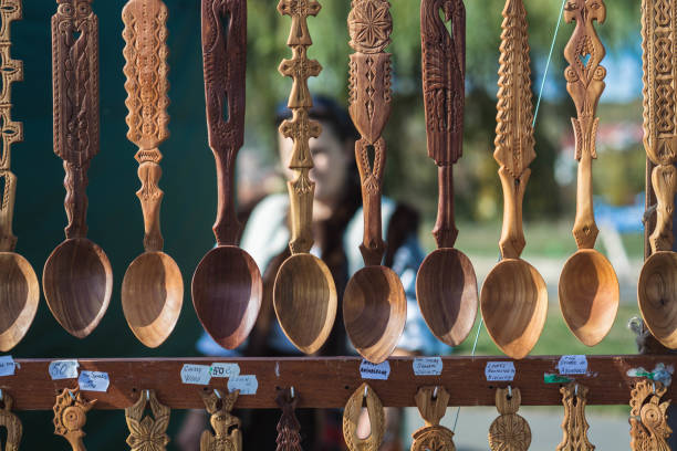 A pile of handcrafted wooden kitchenware showcases artisanal craftsmanship and natural beauty, perfect for rustic decor or culinary themes.