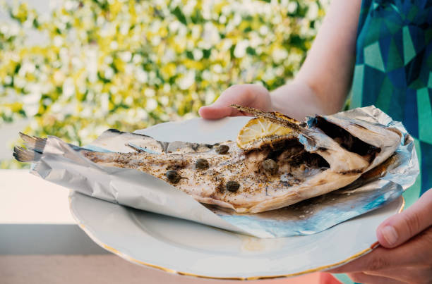 istock Woman presenting home made plate food 865713462