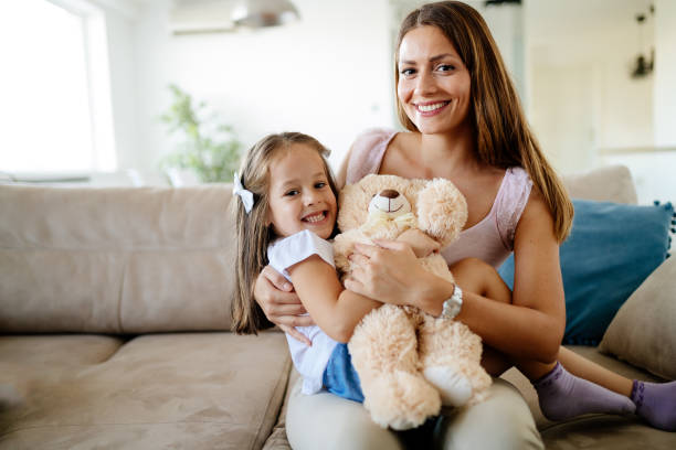 istock Mother and daughter portrait with teddy bear 865714014