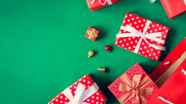 istock top view gift boxes in bag and shopping mall on the green table 865714338