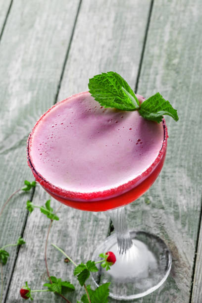 istock Glass of alcoholic raspberry and mint cocktail 865717364