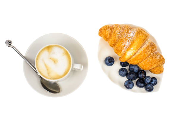 istock Cappuccino, blueberry and fresh croissant for breakfast 865718736
