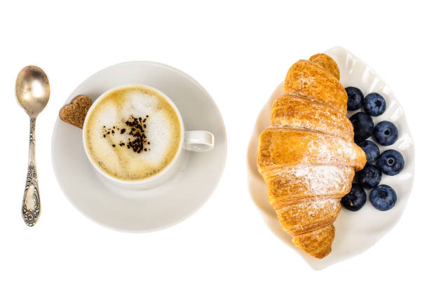 istock Cappuccino, blueberry and fresh croissant for breakfast 865719152