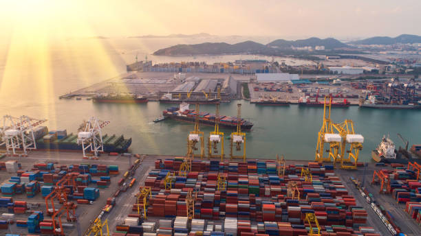 istock container,container ship in import export and business logistic,By crane,Trade Port , Shipping,cargo to harbor.Aerial view,Water transport,International,Shell Marine,transportation,logistic,trade,port 865719554