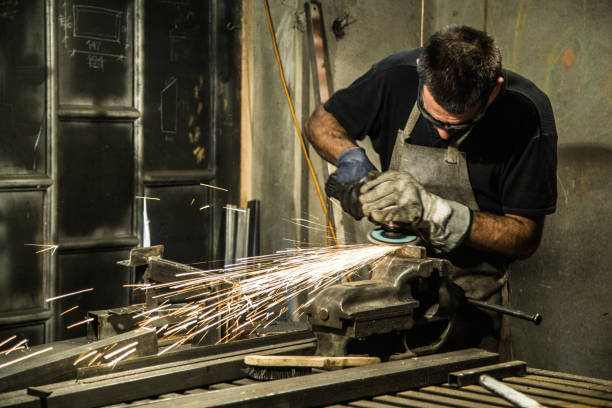 istock Small business owner grinding at his garage 865724552