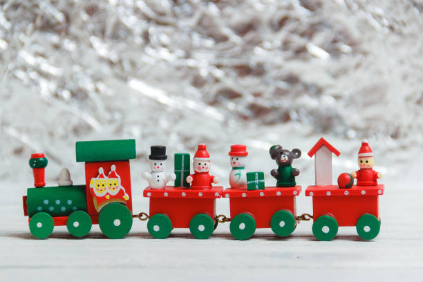 A colorful holiday Christmas train over a white background