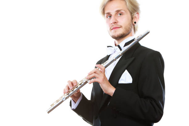 istock Male flutist wearing tailcoat holds flute 865729132