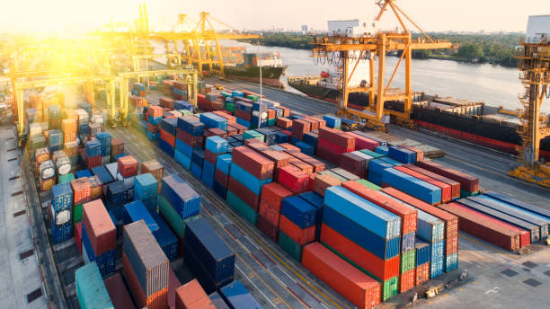 istock container,container ship in import export and business logistic,By crane,Trade Port , Shipping,cargo to harbor.Aerial view,Water transport,International,Shell Marine,transportation,logistic,trade,port 865729482