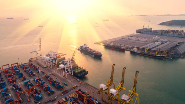 istock container,container ship in import export and business logistic,By crane,Trade Port , Shipping,cargo to harbor.Aerial view,Water transport,International,Shell Marine,transportation,logistic,trade,port 865729486