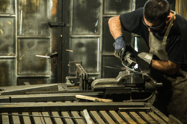 istock Small business owner grinding at his garage 865729502