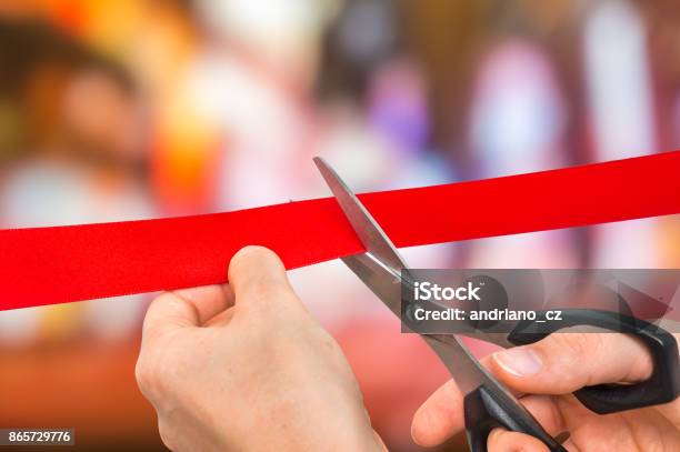 Hand With Scissors Cutting Red Ribbon Opening Ceremony Stock Photo - Download Image Now