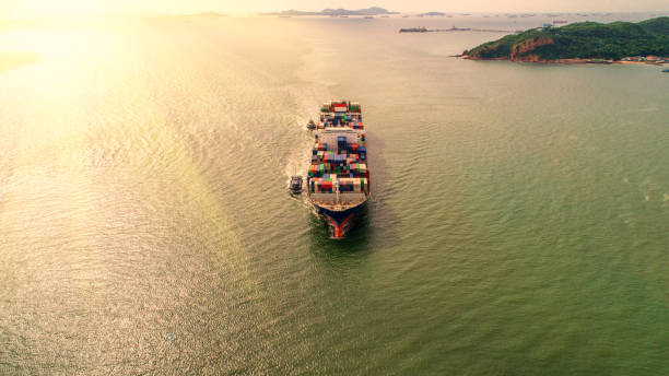 istock container,container ship in import export and business logistic,By crane,Trade Port , Shipping,cargo to harbor.Aerial view,Water transport,International,Shell Marine,transportation,logistic,trade,port 865733668