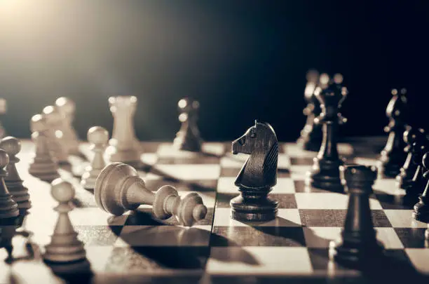 Chess financial business strategy concept. King loses the fight