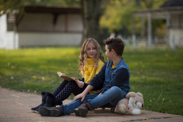 istock Boy and girl enjoying in park 865741488