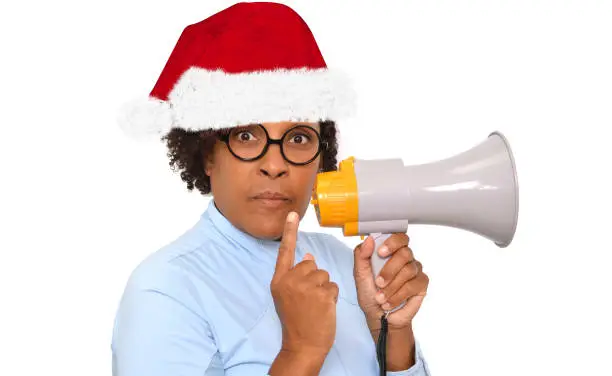 woman wearing Santa hat holding megaphone white background