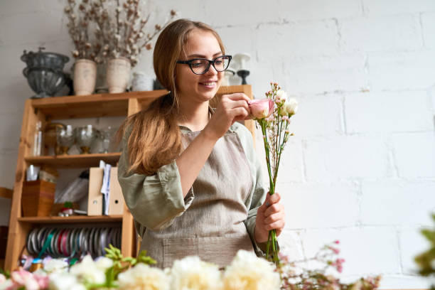 istock Happy attractive florist enjoying work 865742518